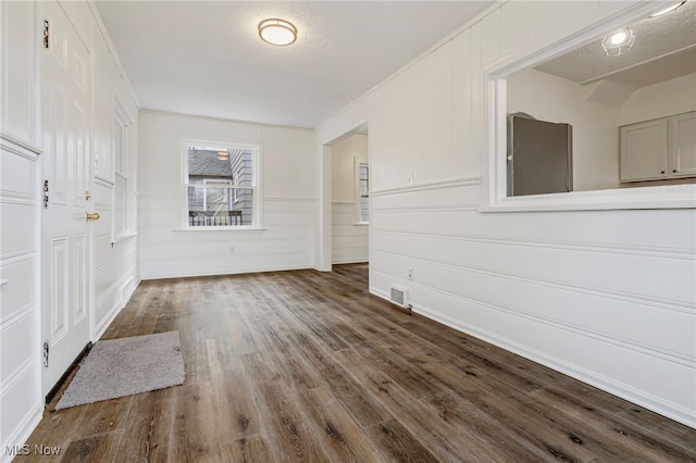 entrance foyer featuring hardwood / wood-style floors and a textured ceiling