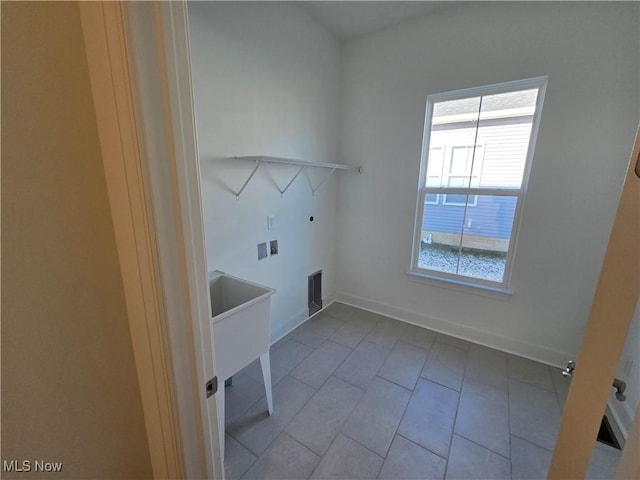 washroom featuring washer hookup and plenty of natural light