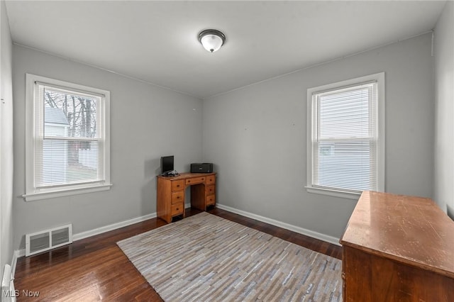 office with dark hardwood / wood-style floors