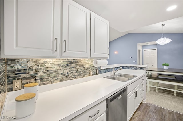 kitchen with white cabinets, sink, dishwasher, hanging light fixtures, and lofted ceiling