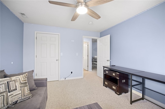 living room with light colored carpet and ceiling fan