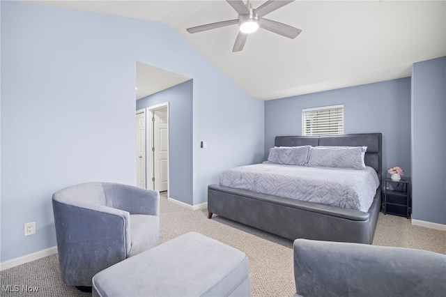 carpeted bedroom with ceiling fan and vaulted ceiling