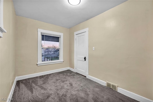 spare room with carpet floors