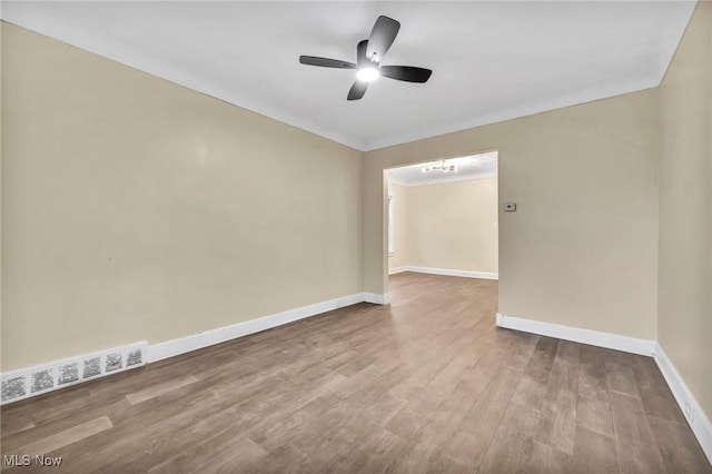 unfurnished room featuring ceiling fan and hardwood / wood-style flooring