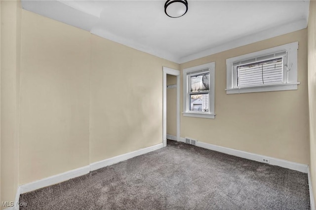 empty room with carpet flooring