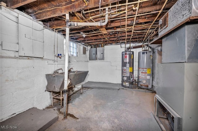 basement featuring sink, electric panel, and water heater