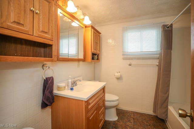 full bathroom featuring ornamental molding, vanity, a textured ceiling, shower / bath combo with shower curtain, and toilet