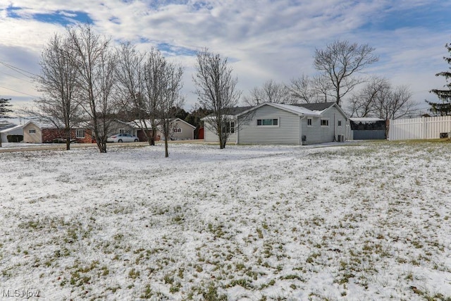 view of yard layered in snow