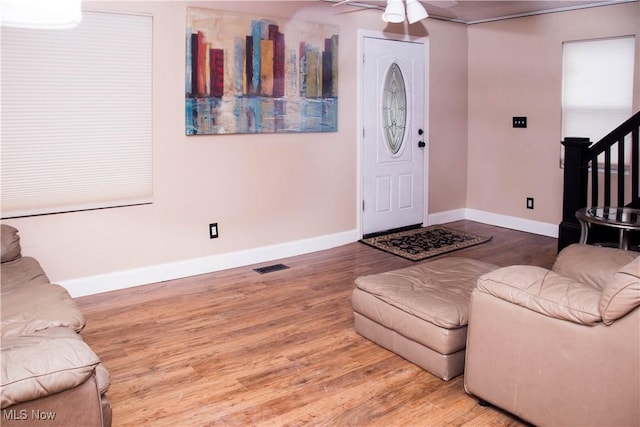 entrance foyer with ceiling fan and hardwood / wood-style floors