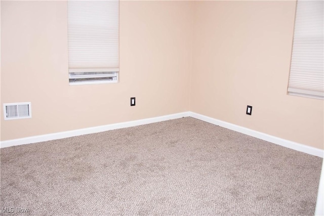 empty room featuring carpet flooring