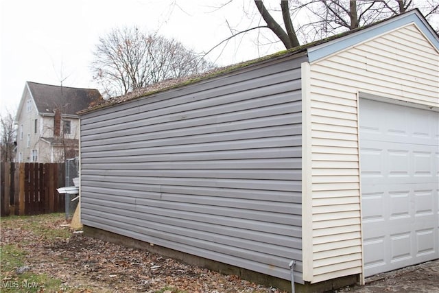 exterior space with an outbuilding and a garage