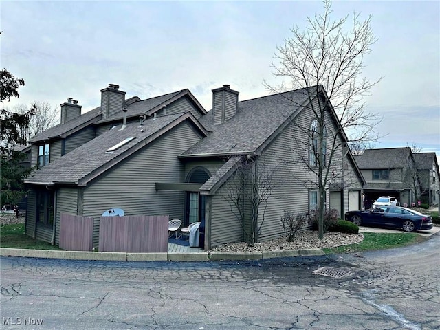 view of side of property featuring a garage