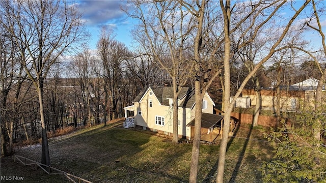 view of side of home featuring a lawn