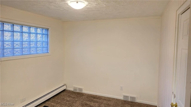 carpeted empty room featuring a textured ceiling and a baseboard radiator