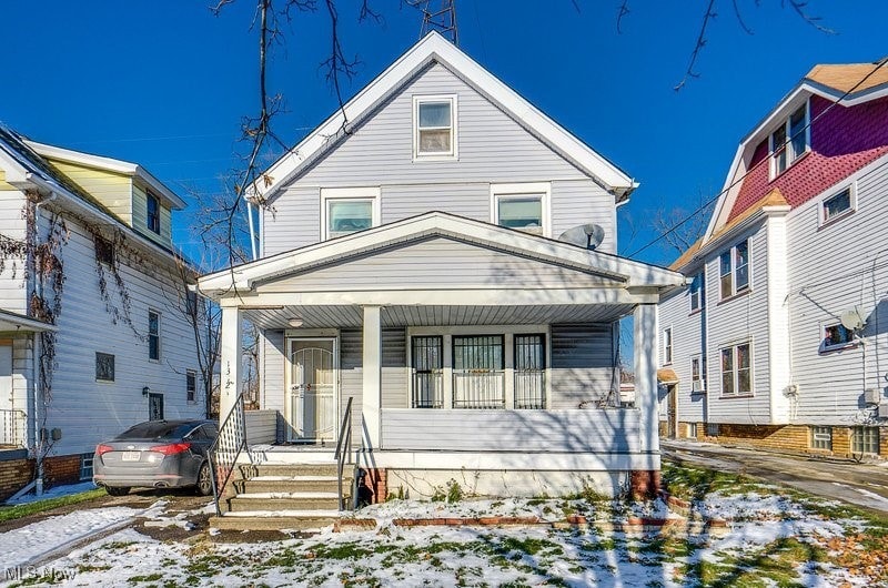 13321 Caine Ave, Cleveland, OH 44105 - view of front facade featuring a porch