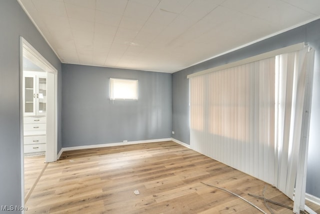 empty room with light hardwood / wood-style floors