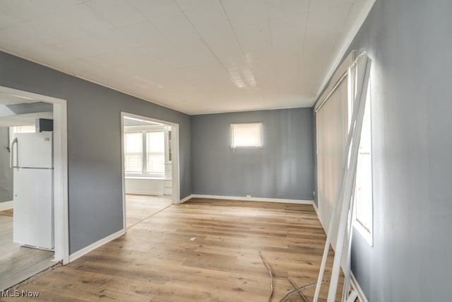 spare room with light wood-type flooring