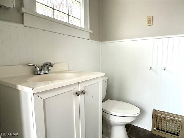 bathroom with vanity and toilet