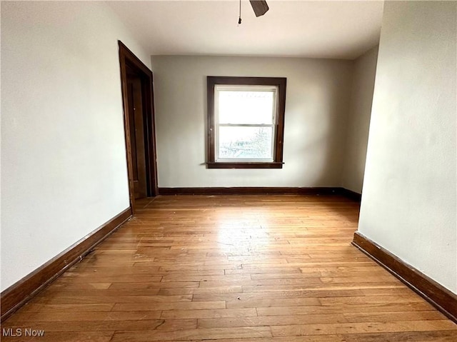 unfurnished room featuring ceiling fan and light hardwood / wood-style floors