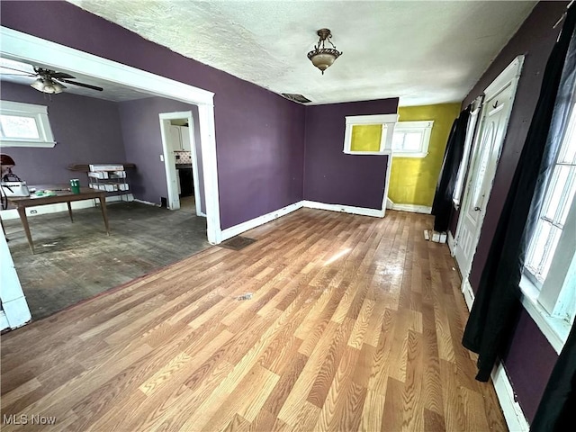 interior space with ceiling fan and light wood-type flooring