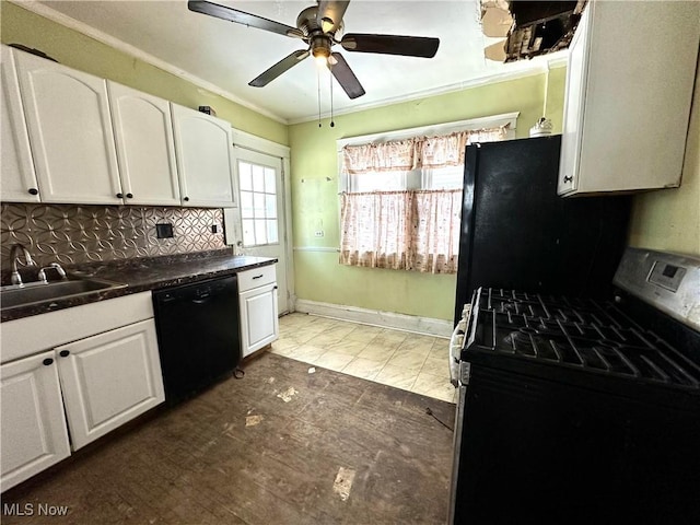 kitchen featuring tasteful backsplash, white cabinetry, sink, and black appliances