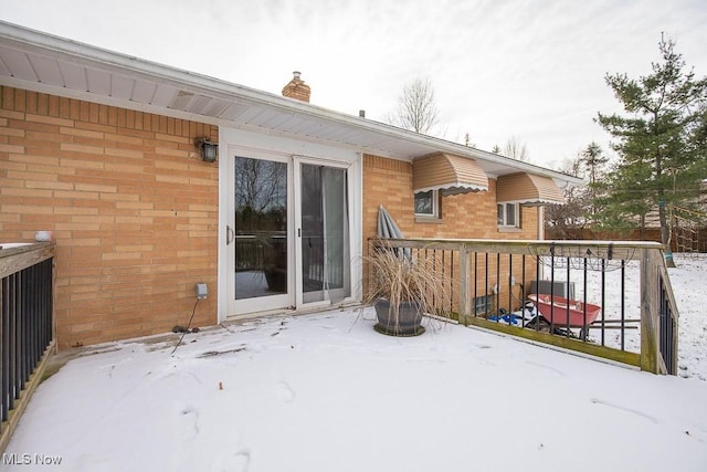 view of snow covered deck