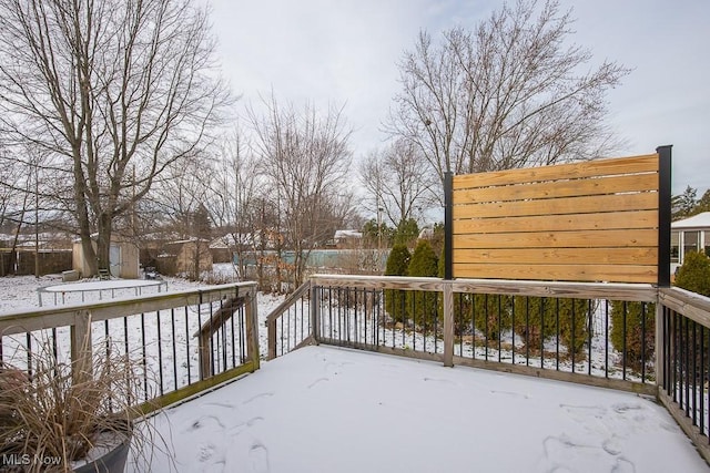 view of snow covered deck