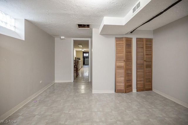 interior space with a textured ceiling