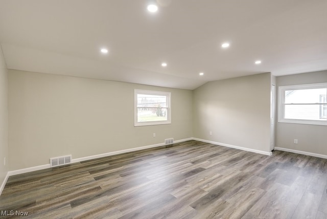 unfurnished room with dark hardwood / wood-style floors