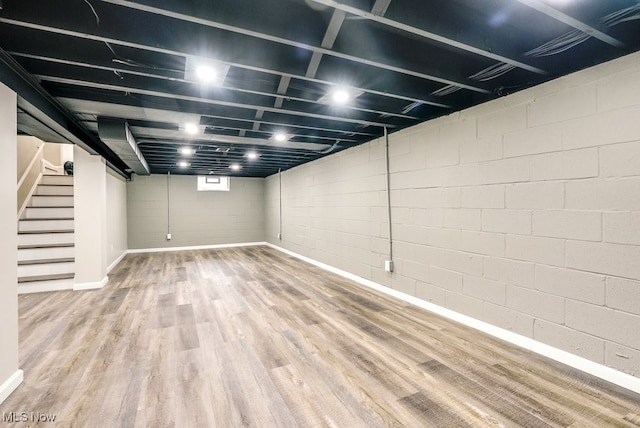 basement featuring hardwood / wood-style flooring