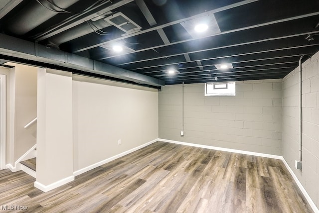 basement featuring hardwood / wood-style flooring