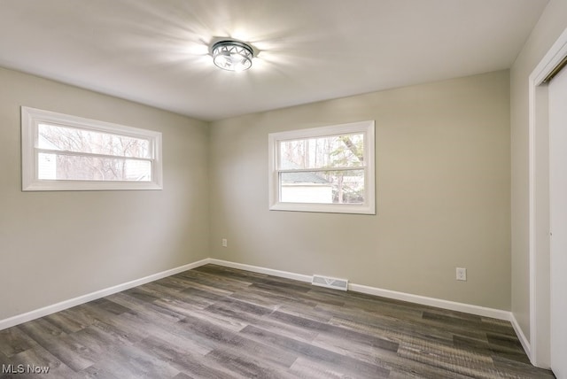 unfurnished room featuring hardwood / wood-style flooring