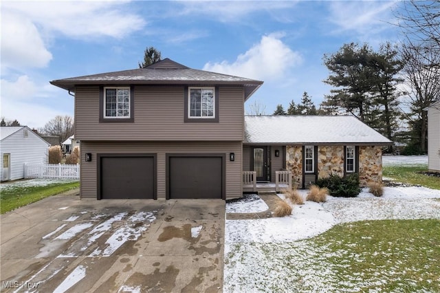 view of front facade featuring a garage and a lawn