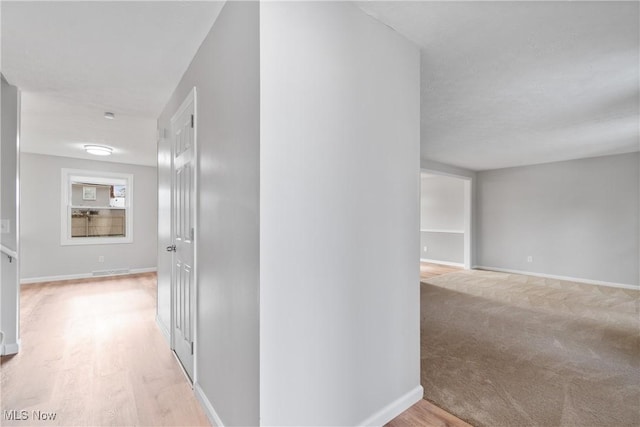 corridor featuring light hardwood / wood-style flooring