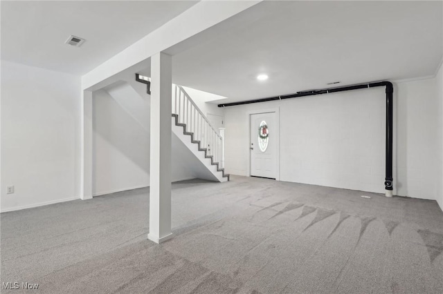 basement with light colored carpet