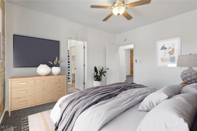 carpeted bedroom with ceiling fan