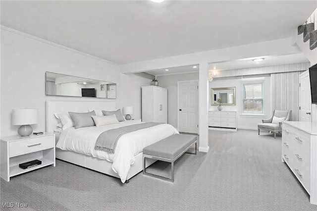 bedroom with light colored carpet