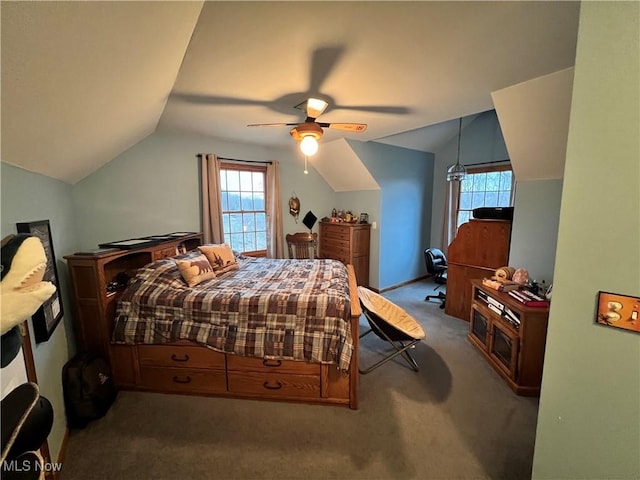 carpeted bedroom featuring ceiling fan and vaulted ceiling