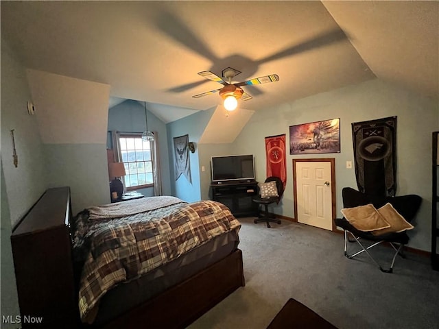 carpeted bedroom featuring ceiling fan and vaulted ceiling