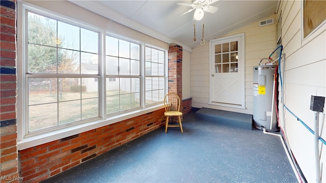 sunroom / solarium with ceiling fan, vaulted ceiling, and water heater