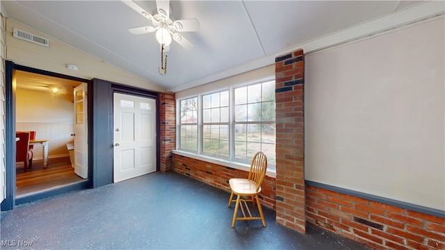 interior space featuring ceiling fan and vaulted ceiling