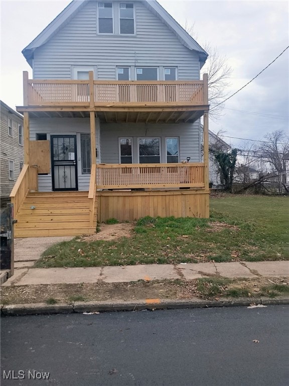 view of front of house featuring a balcony