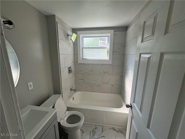 full bathroom with vanity, toilet, and tiled shower / bath