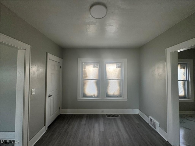 interior space with dark hardwood / wood-style floors