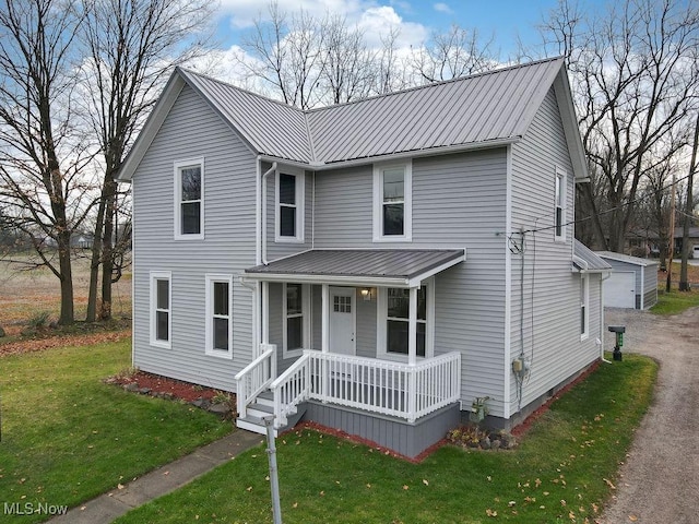 view of front facade with a front yard and a porch