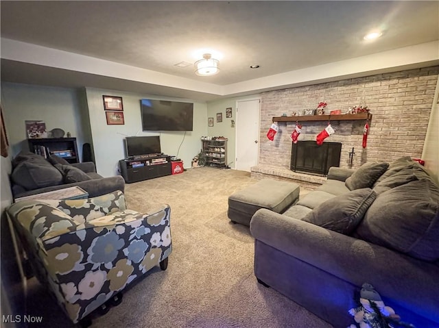 carpeted living room with a fireplace