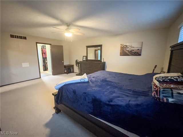 bedroom with ceiling fan and carpet floors