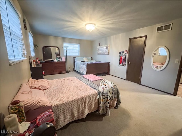 bedroom with light carpet