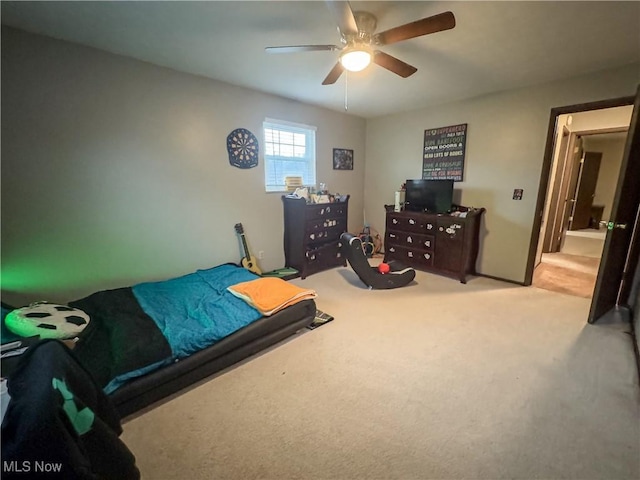 bedroom featuring ceiling fan and light colored carpet