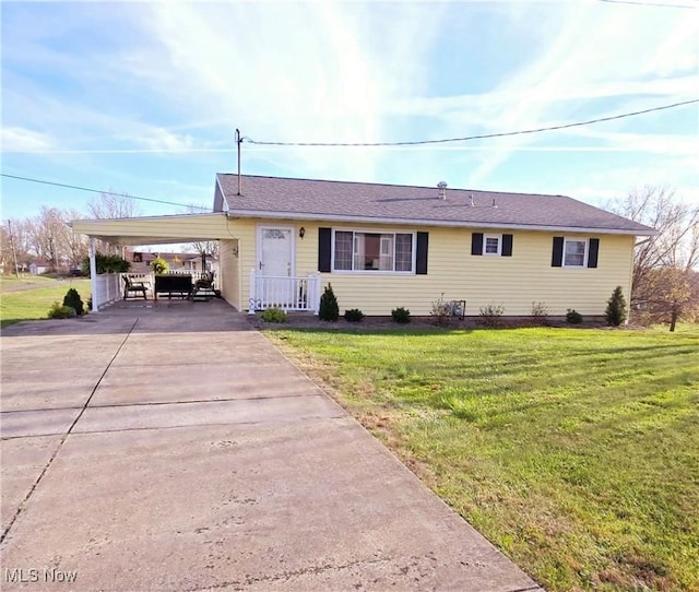 ranch-style house with a carport and a front yard